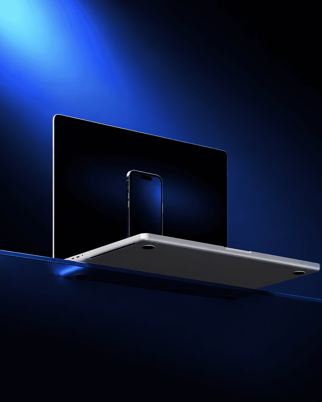 A laptop and phone floating on a deep blue stage
